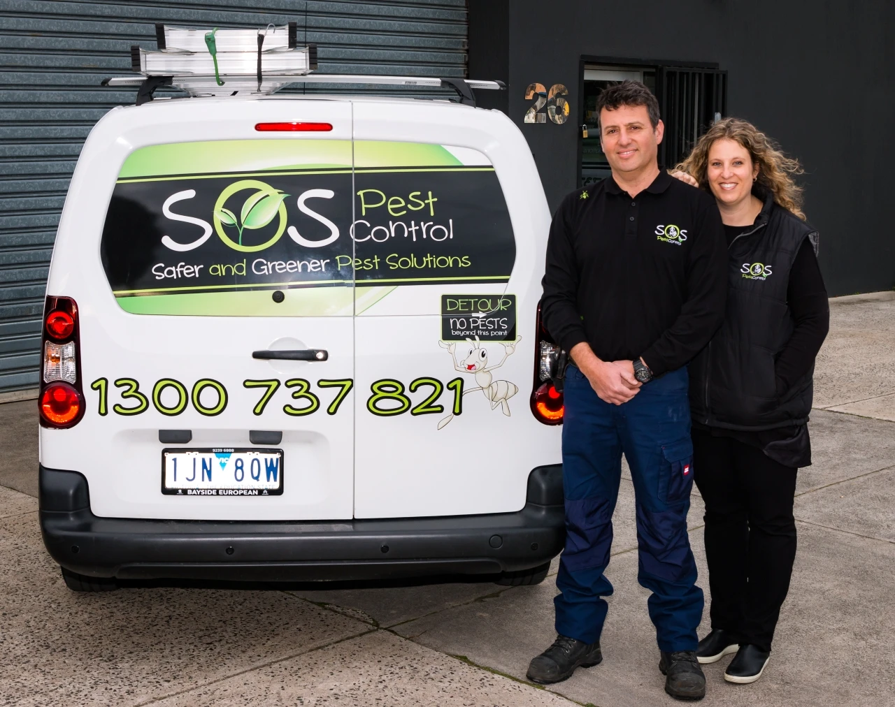 Ron and Candys with the SOS Pest Control vans